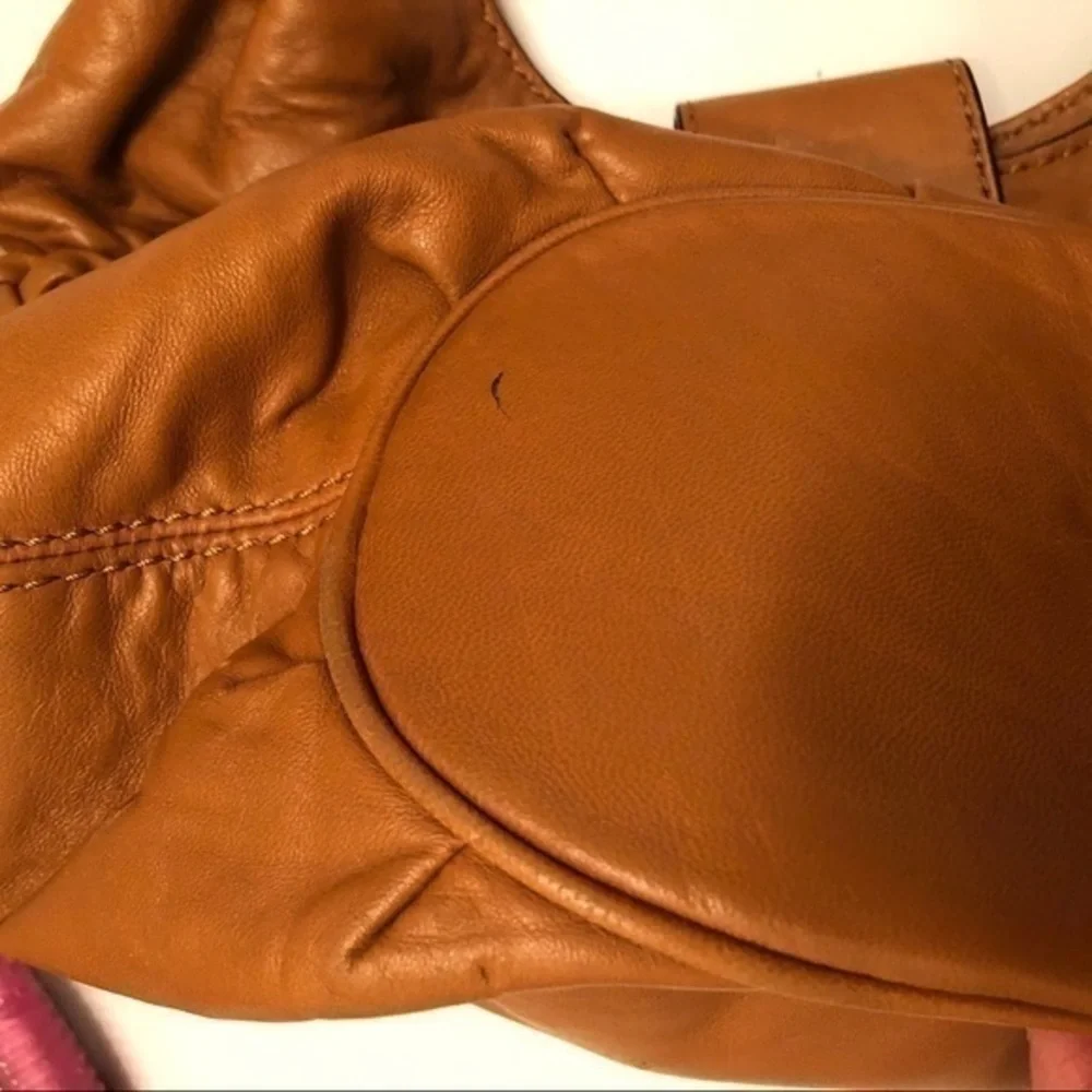 Michael kors brown leather grommet tassel bag
